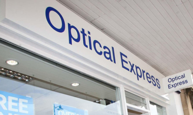 Former Olympian Daley Thompson scissor- jumps red tape to officially open Optical Express in Bearsden, Glasgow.