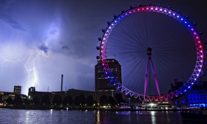 Lightning strikes behind the London Eye in the early hours of Tuesday.