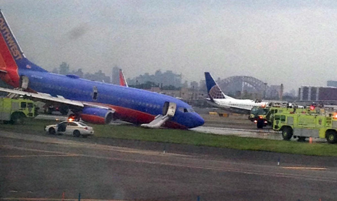 A photo provided by Jared Rosenstein shows the plane's collapsed nose gear.