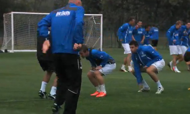 The coaches and players recoil as the lightning strikes.