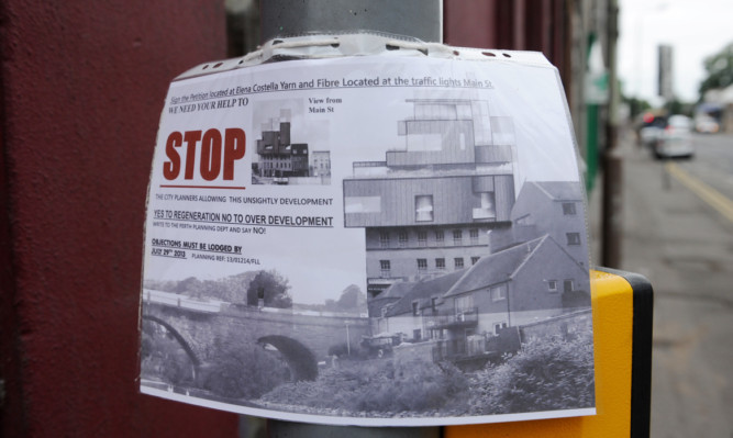 A notice appealing for people to sign a petition against the proposed residential development in Bridgend.
