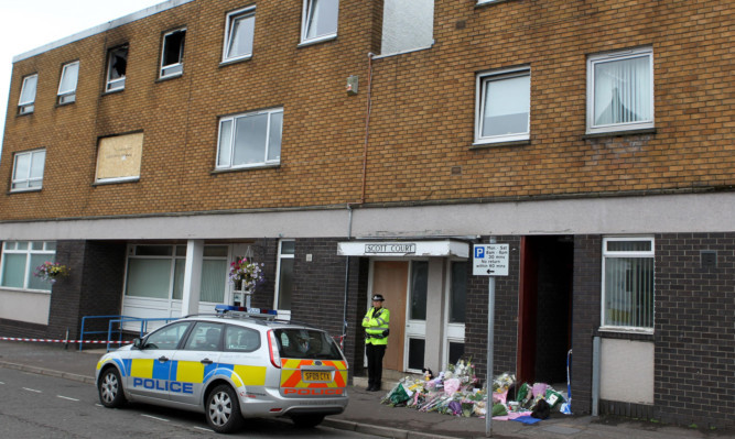 Thomas Sharkey was killed along with his 8-year-old daughter Bridget and 21-year-old son Thomas Jr at their family home in Helensburgh.