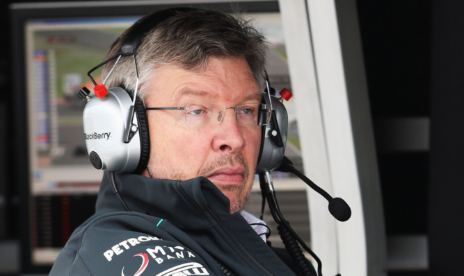 Ross Brawn watching practice for the German Grand Prix earlier this month.