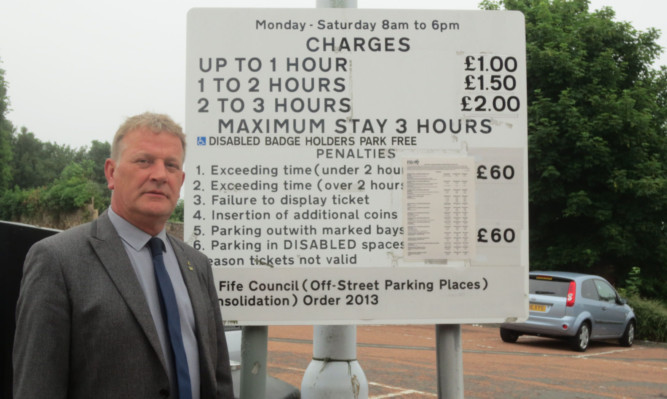 David Torrance MSP pictured in a Kirkcaldy car park that had been facing increases in parking charges.