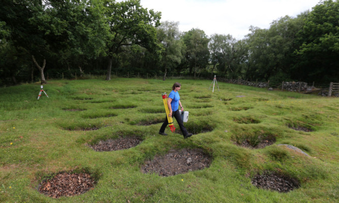 Dr Lyn Wilson with 3D scanning equipment at the northern defences of the Antonine Wall at Rough Castle, Bonnybridge.