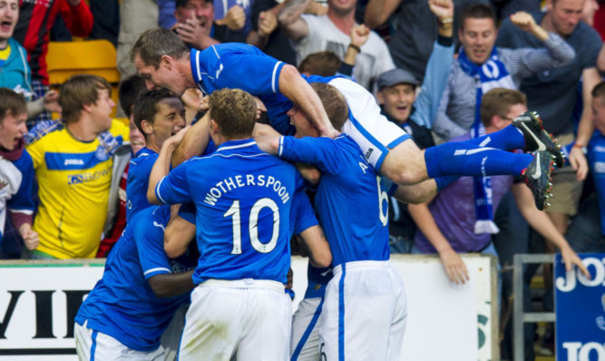 Stevie May is mobbed after what proved to be his winning goal.