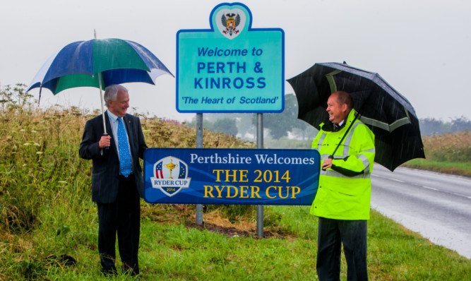 Councillor Ian Miller, left, and roads service manager Charles Haggart with one of the signs on the A94 at Castleton.