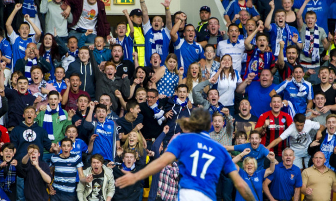 Stevie May rushes to the St Johnstone fans to celebrate his goal.