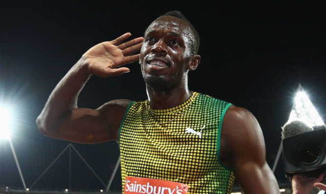 The king of the track and king of cool  Usain Bolt plays to the crowd.