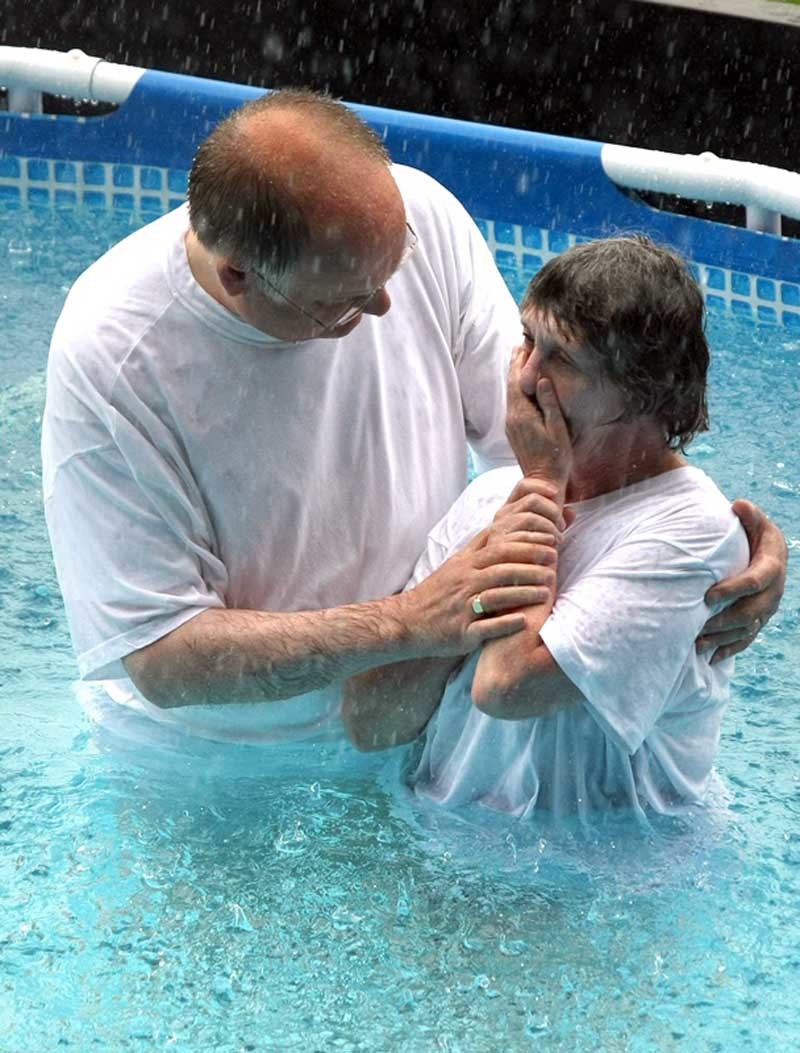 Kris Miller, Courier, 16/07/11. Picture today at Jehovahs Witness Convention, McDiarmid Park, Perth shows Baptism taking place in the giant pool during the torrential rain