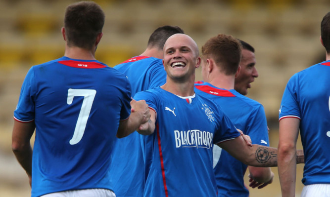 Nicky Law celebrates his opening goal.