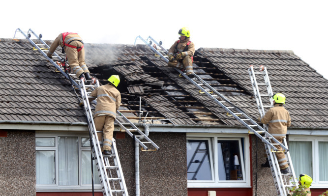 Firefighters tackle the blaze at Mull Terrace.