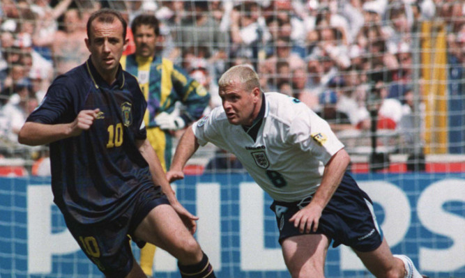 Gary McAllister takes on Paul Gascoigne during Euro 96.