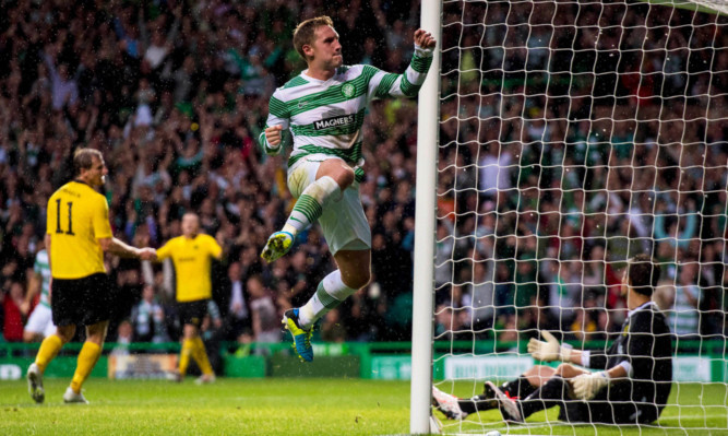 Celtics Kris Commons jumps for joy after opening the scoring.