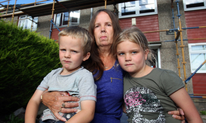 Grandmother Margaret Samson with Reece Milne and Keighsha Samson.