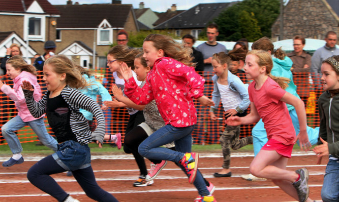 Youngsters competing in the 'mini highland games'.