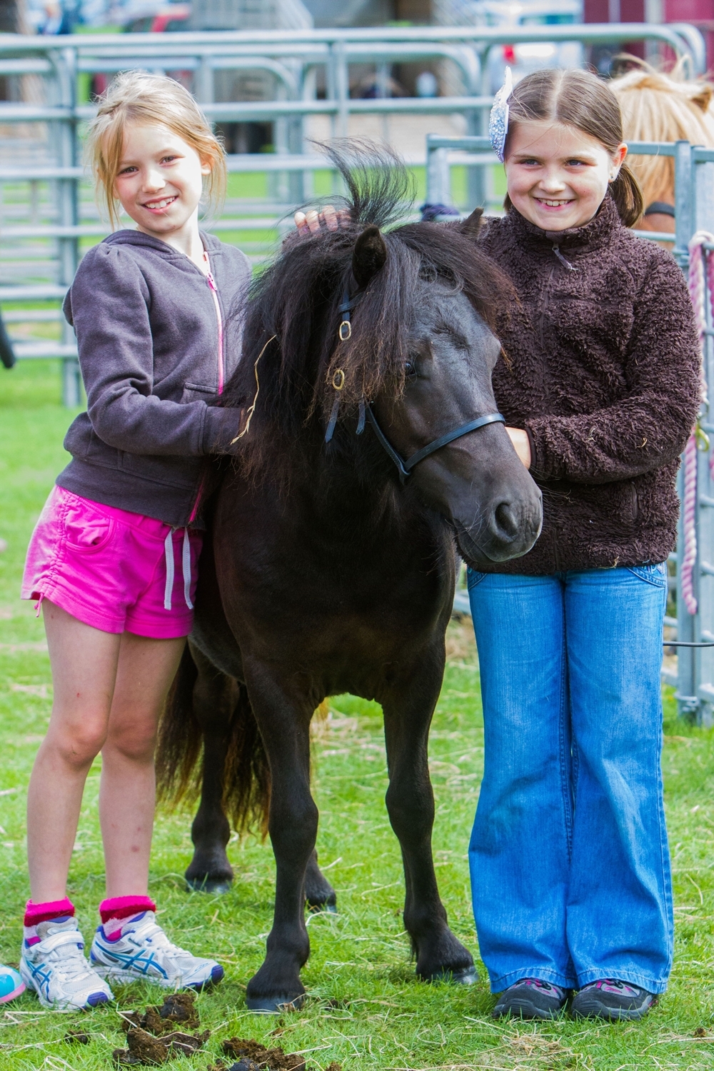 Steve MacDougall, Courier, South Inch park, Edinburgh Road, Perth. Perth Show 2013. Scenes from the Saturday events. Pictured, left is Elizabeth Dewar (aged 8, from Perth) and right is Jodie McAuslane (aged 8 from Tillicoultry) alongside Shetland Pony 'Mawcarse Countess April'.