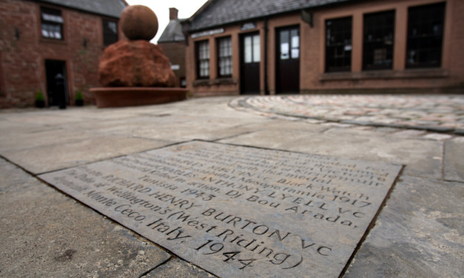The paving stone marking the award of the Victoria Cross (VC) to local soldiers in Kirriemuir.