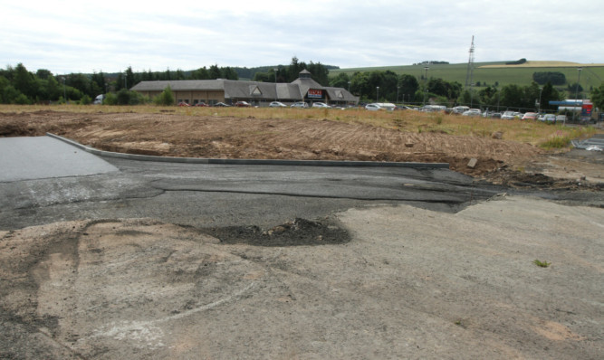 The supermarket has been criticised for the delay on work on a new superstore.