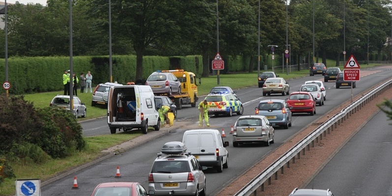 Steve MacDougall, Courier, Kingsway, opposite Kingsway Retail Park, Dundee. Accident involving multiple cars on East bound lanes of Kingsway. Pictured, traffic moves slowly past the accident scene.