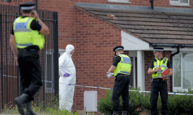 Police and forensic officers near the scene of a shooting in Newport.