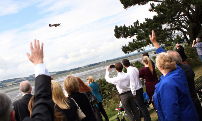 a Hurricane flies over Sleepyhillock Cemetery, Montrose, where the family of Ronald and Alice Jordan visited their grave site.