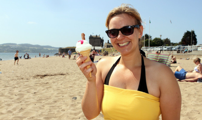 Erin Linton from Broughty Ferry enjoying an ice cream on the beach during last months warm and sunny weather.