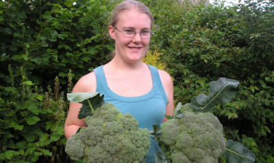 Marigold Massie, daughter of Moira Thomson, with some of the produce grown by the charity using rockdust.