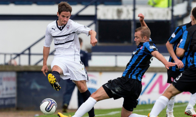 Kevin Moon (left) is challenged by Hamilton's Grant Gillespie.