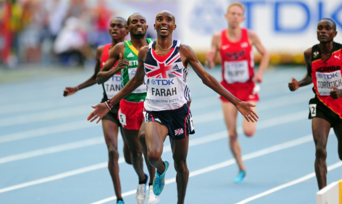 Great Britain's Mo Farah crosses the line to win the Men's 10000m.