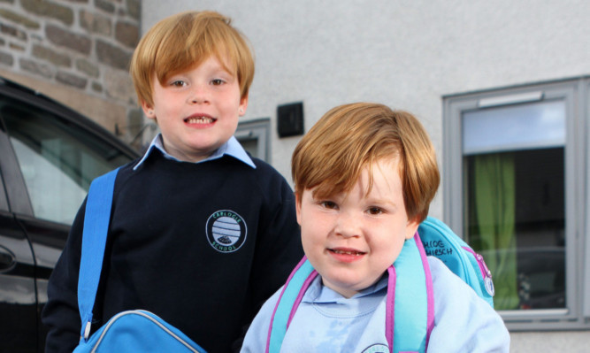 The girls in their school uniforms.