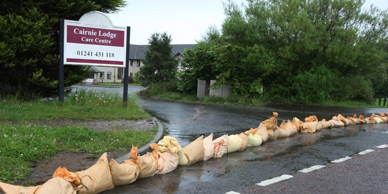 DOUGIE NICOLSON, COURIER, 07/08/11, NEWS. Pic shows sand bags lined up outside the Cairnie Lodge Care Centre in Arbroath today, Sunday 7th August 2011, to stop the flood waters. Story by Graham Brown, Forfar.