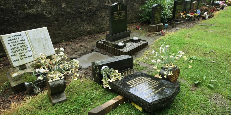 DOUGIE NICOLSON, COURIER, 07/08/11, NEWS. 
Pic shows one of the gravestones pushed over in Balgay Cemetery today, Sunday 7th August 2011, Story by Reporters.