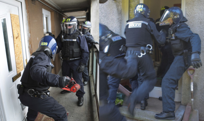 Police officers conduct drugs raids in Glenrothes.