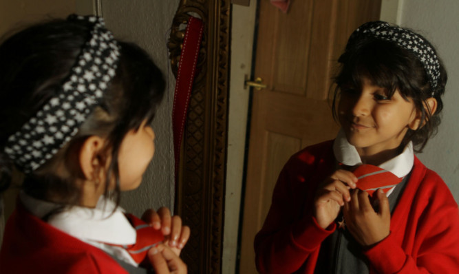 Sarah applies the finishing touches before her big day.