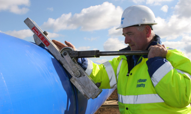 Balfour Beatty reported a pre-tax loss of £6m for the first six months, a turnaround of almost £100m on the £92m profit of 12 months ago.