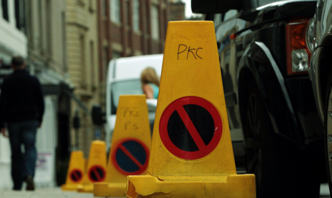 Traffic cones set out on George Street, Perth, provoked an angry response from shopkeepers.