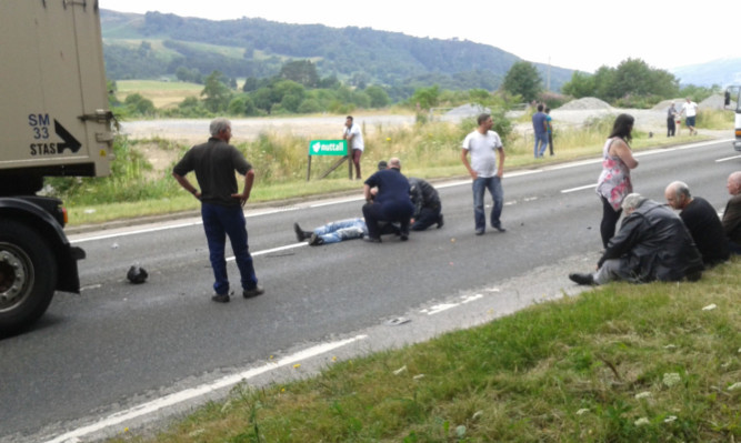 Paul lies in the road moments after the dramatic crash.