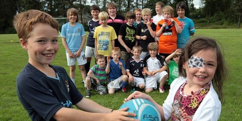 Kim Cessford, Courier 15.08.11 - Drew Wighton and his pals organised a charity football match on the fieldy behind Greenlee Drive off South Road to raise funds so that their pal Madison Barclay, the 8 year old who is dying can go on holiday to Florida - pictured are the young footballers with front l to r - Drew Wighton and Madison Barclay