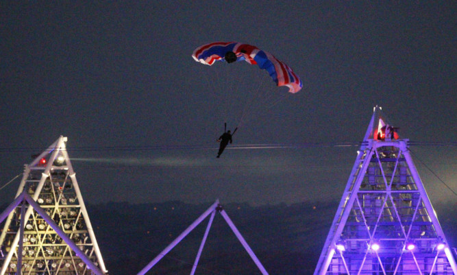 Mark Sutton parachutes into the Olympic Stadium