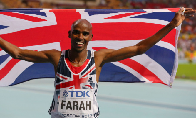 Mo Farah celebrates.