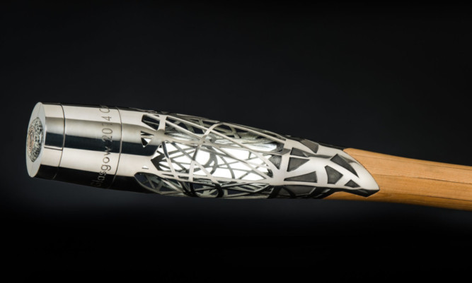 The baton is made of titanium, wood and graphite.