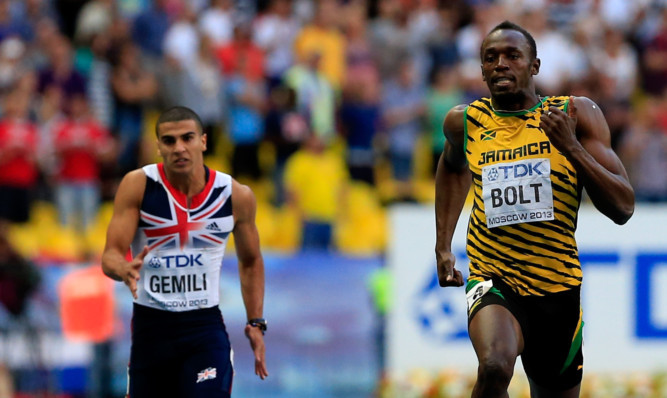 Adam Gemili sees Usain Bolt tear past him in Saturday's final.