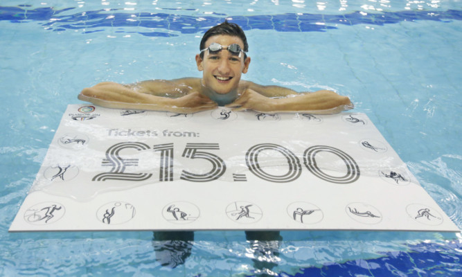 Michael Jamieson marks the start of ticket sales for the  Commonwealth Games at Tollcross International Swimming Centre.