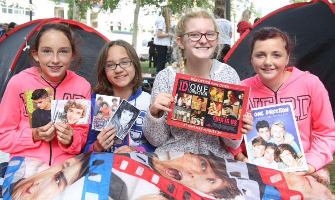 One Direction fans Chloe Glasscoe 13, Lianne Kidd 15, Kelsey Smith 14 and Caitlin Derrick 12 who have been camping to watch the band arrive in Leicester Square.