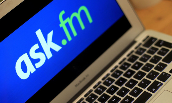 LONDON, ENGLAND - AUGUST 19:   In this photo illustration a laptop computer shows the Ask.FM website, on August 19, 2013 in London, England. The site has been criticised by the British PM David Cameron who urged parents to boycott "vile sites". The Ask.FM wedsite has been linked to two bullying cases where the young person has taken there own life.  (Photo by Danny E. Martindale/Getty Images)