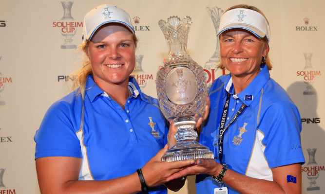 Europe captain Liselotte Neumann (right) with Caroline Hedwall, the first player in either Solheim Cup or Ryder Cup history to finish the matches with a perfect 5-0 record.