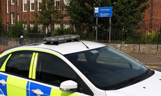 A police car outside the temporary Harris Academy in Lawton Road on Tuesday afternoon.