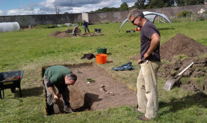 The archaeology team digging at House of Dun, where they unearthed pottery from the early 14th Century.