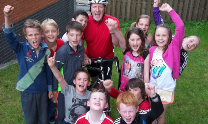 Howard Barr with some of the children who use the Dunblane Centre.
